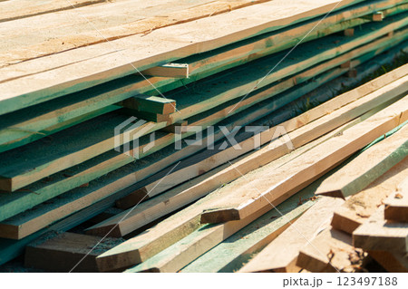 Wood timber in the sawmill. Piles of wooden boards in the sawmill. Wood, timber, wood blanks, construction material. Wood timber in the sawmill. Piles of wooden boards in the sawmill. Wood, timber, wood blanks, construction material. 123497188