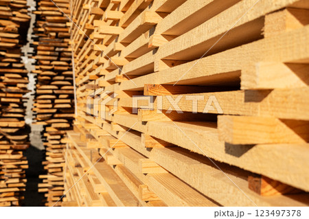 Stacked boards on a sawmill. Production of lumber Stacked boards on a sawmill. Production of lumber 123497378
