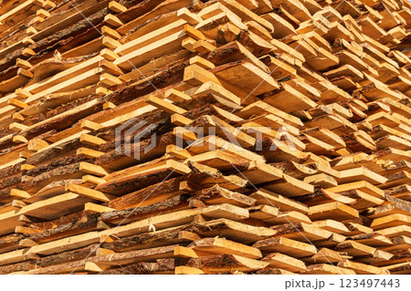 Wooden boards, bars in a lumber warehouse. Production of wooden boards Wooden boards, bars in a lumber warehouse. Production of wooden boards 123497443
