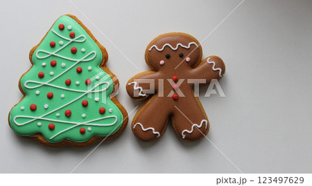Holidays Background With Gingerbread Man And Pine Tree Cookies With Decorative Icing Isolated On White Holidays Background With Gingerbread Man And Pine Tree Cookies With Decorative Icing Isolated On White 123497629
