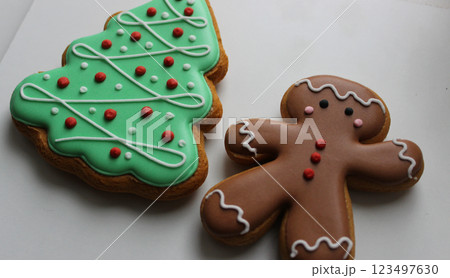 Shortbread Cookies In Shape Of Funny Man And Pine Tree On White Surface Angle View Shortbread Cookies In Shape Of Funny Man And Pine Tree On White Surface Angle View 123497630