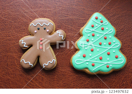 Shortbread Cookies In Shape Of Funny Man And Pine Tree On Brown Leather Surface Concept Design For Greeting Card Shortbread Cookies In Shape Of Funny Man And Pine Tree On Brown Leather Surface Concept Design For Greeting Card 123497632
