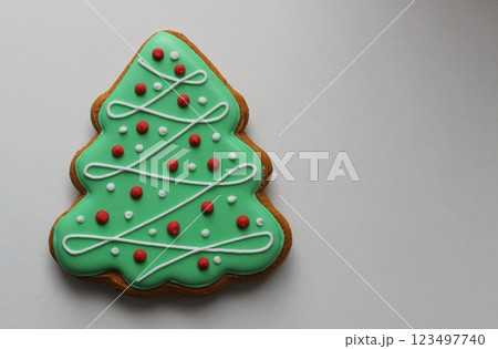 Shortbread Cookie In Pine Tree Shape With Colored Icing Isolated On White Concept Design For Greeting Card Shortbread Cookie In Pine Tree Shape With Colored Icing Isolated On White Concept Design For Greeting Card 123497740