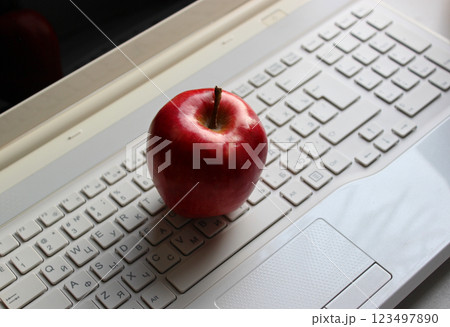 Fresh Red Apple On Laptop Keypad With Latin And Cyrillic Characters Fresh Red Apple On Laptop Keypad With Latin And Cyrillic Characters 123497890