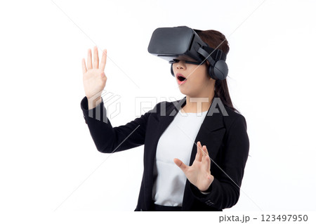 Portrait young asian businesswoman wearing headset virtual reality for device with experience. 123497950