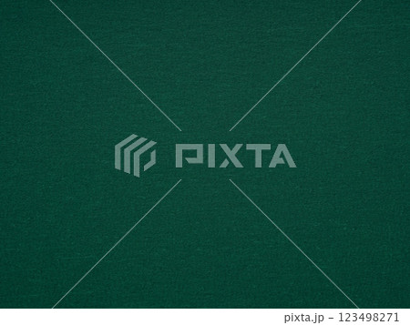 A close-up shot captures the sophisticated simplicity of a dark green paper surface with inviting texture and depth A close-up shot captures the sophisticated simplicity of a dark green paper surface with inviting texture and depth 123498271