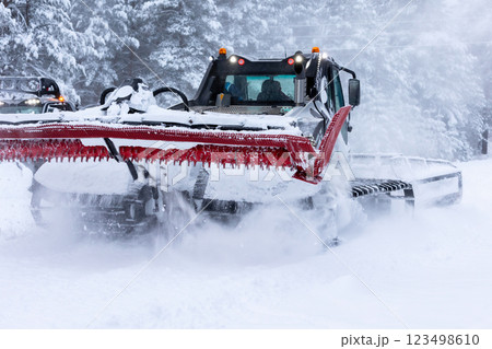 Snow groomer ratrack machine, ski slope 123498610