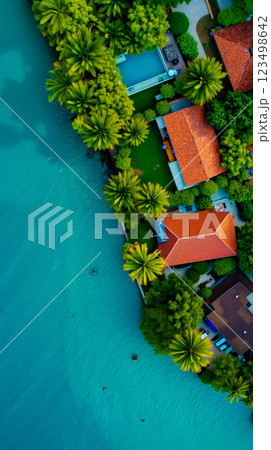 Aerial view of a tropical resort surrounded by palm trees Aerial view of a tropical resort surrounded by palm trees 123498642