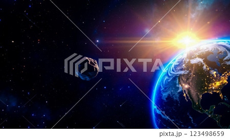 A view of the earth and an asteroid in space 123498659