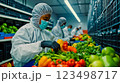 A group of people in protective gear working in a grocery store 123498717