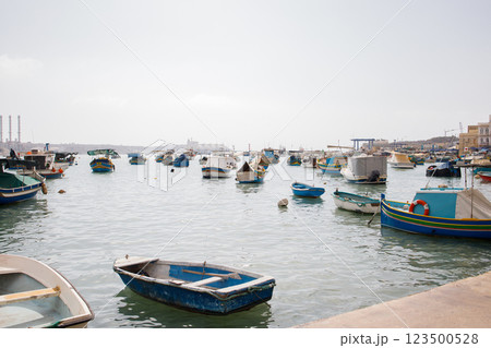 Many fishers boats moored in Marsaxlokk bay on Malta 123500528