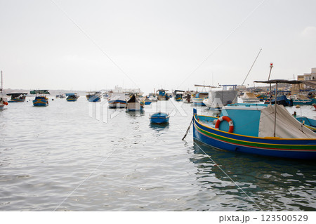 Many fishers boats moored in Marsaxlokk bay on Malta 123500529