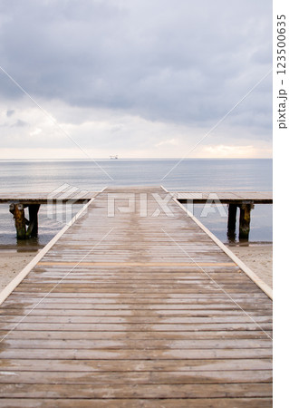 Way to the sea on wooden pier in Baltic sea in Sopot, Poland 123500635