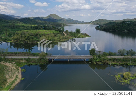 View from the top of a bridge in Thailand, surrounded by a river and various trees. View from the top of a bridge in Thailand, surrounded by a river and various trees. 123501141