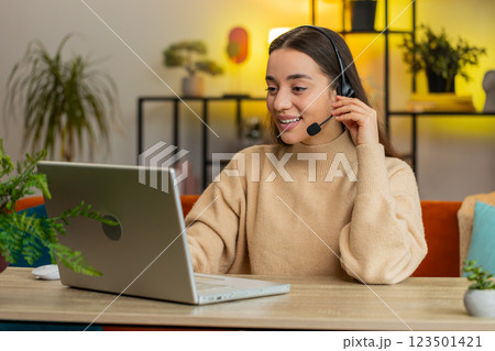 Woman freelance worker call center or support service operator helpline having talk with client 123501421