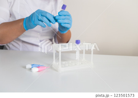 Medical laboratory doctor preparing workplace for making children blood tests Medical laboratory doctor preparing workplace for making children blood tests 123501573