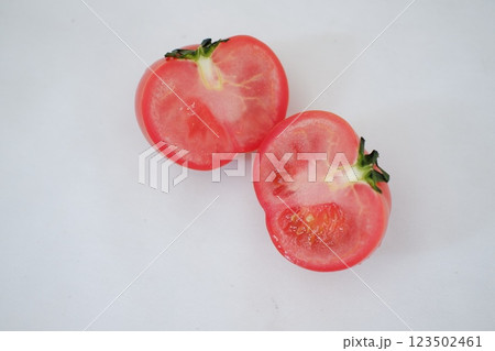Tomatoes on a white background. Slices of tomatoes. 123502461