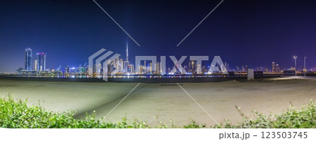 Stunning view of Dubai skyline at night featuring Burj Khalifa and city lights 123503745