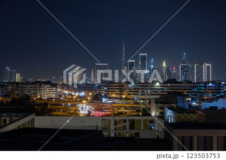Stunning view of Dubai skyline at night featuring Burj Khalifa and city lights 123503753