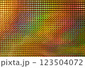 A vibrant, multicolored holographic surface featuring a pattern of raised diamond shapes, reflecting light and creating a dynamic visual effect. 123504072