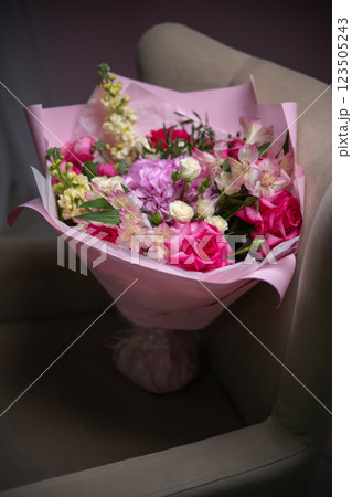 Delicate composition of white and pink roses in a basket Delicate composition of white and pink roses in a basket 123505243
