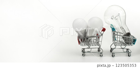 the concept of energy saving and economy. buy LED lamps. light bulbs in the shopping basket. 123505353