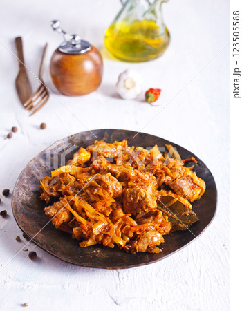 Stewed or braised cabbage served on dark plate Stewed or braised cabbage served on dark plate 123505588