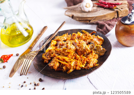 Stewed or braised cabbage served on dark plate Stewed or braised cabbage served on dark plate 123505589