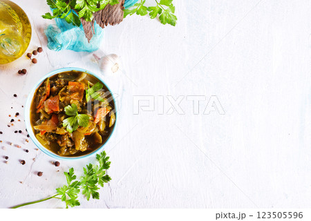 Baked vegetable salad in a cermaic bowl over light background. Delicious healthy autumn or winter salad, seasonal food. Baked vegetable salad in a cermaic bowl over light background. Delicious healthy autumn or winter salad, seasonal food. 123505596