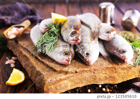 Fresh small fish on stone board 123505610