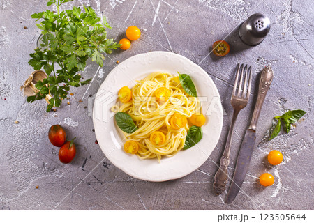 Pasta spaghetti with tomatoes and fresh basil in a plate Pasta spaghetti with tomatoes and fresh basil in a plate 123505644
