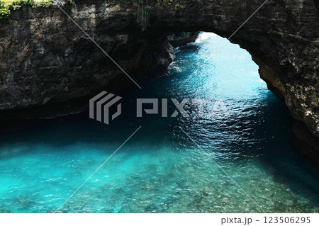 Beautiful landscape view of cave in rocky cliff and blue sea for destination travel at Broken Beach Nusa Penida, Bali, Indonesia Beautiful landscape view of cave in rocky cliff and blue sea for destination travel at Broken Beach Nusa Penida, Bali, Indonesia 123506295