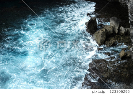 Beautiful landscape aerial view of surf and aqua surface in the sea with foam waves and splash water of ocean with rocky cliff beach Beautiful landscape aerial view of surf and aqua surface in the sea with foam waves and splash water of ocean with rocky cliff beach 123506296