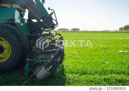 The Importance of Green Lawn Landscape Maintenance Utilizing a Riding Mower for Growth Efficiency and Density The Importance of Green Lawn Landscape Maintenance Utilizing a Riding Mower for Growth Efficiency and Density 123508353