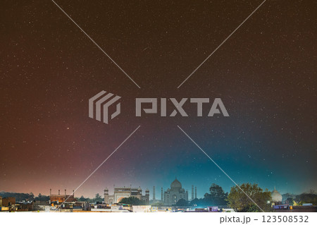 Taj Mahal In Agra, Uttar Pradesh, India. Night view Of Taj Mahal. Seven World Wonders. Night stars above Fabulous Taj Mahal Travel Concept. Indian Islamic Heritage At Night Time Taj Mahal In Agra, Uttar Pradesh, India. Night view Of Taj Mahal. Seven World Wonders. Night stars above Fabulous Taj Mahal Travel Concept. Indian Islamic Heritage At Night Time 123508532