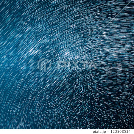 Trails Of Stars. Bewitching Illusion Of Star Trails. Star And Meteoric Trails On Night Sky Background. Spin Of Unusual Amazing Stars Effect In Sky Trails Of Stars. Bewitching Illusion Of Star Trails. Star And Meteoric Trails On Night Sky Background. Spin Of Unusual Amazing Stars Effect In Sky 123508534