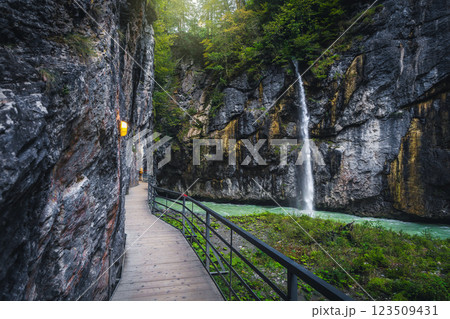 Waterfall and narrow footbridge in the Aare gorge, Meiringen, Switzerland 123509431