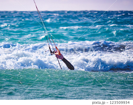 Kite surfer in sea waves. Kiteboarding sport. Kite surfer in sea waves. Kiteboarding sport. 123509934