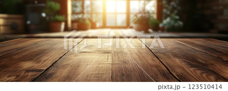 Wooden Table Surface with Sunset Blurry Cityscape and Nature Background, Warm Tones, and Soft Focus Lights Creating a Cozy Atmosphere for Relaxation 123510414
