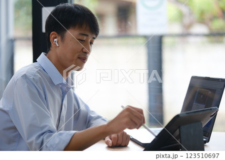 Business consultant advising clients and team in a video conference Business consultant advising clients and team in a video conference 123510697