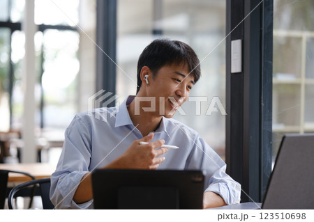 Business consultant advising clients and team in a video conference Business consultant advising clients and team in a video conference 123510698
