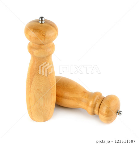 Wooden salt shaker and pepper mill isolated on white background. Wooden salt shaker and pepper mill isolated on white background. 123511597