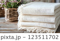 Stack of Cream Gauze Fabrics with Rustic Decor 123511702