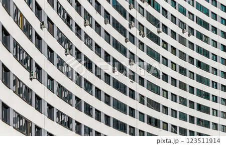 Modern architecture and building design in a developing urban neighborhood. Multi-story high-rise Modern architecture and building design in a developing urban neighborhood. Multi-story high-rise 123511914