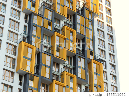 Modern high-rise residential building with bright yellow balconies in an urban metropolis. 123511962