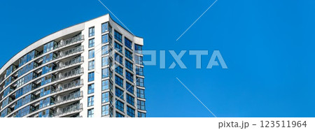 Modern multi-story high-rise building in city, residential property under development. Concrete 123511964
