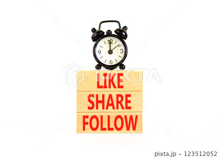 Like share follow symbol. Concept words Like Share Follow on beautiful wooden blocks. Beautiful white background. Black alarm clock. Business like share follow concept. Copy space. Like share follow symbol. Concept words Like Share Follow on beautiful wooden blocks. Beautiful white background. Black alarm clock. Business like share follow concept. Copy space. 123512052