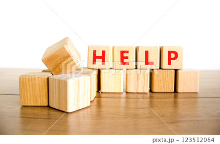 Help symbol. Concept word Help on beautiful wooden blocks. Beautiful wooden table white background. Business, lifestyle, support and help concept. Copy space. 123512084