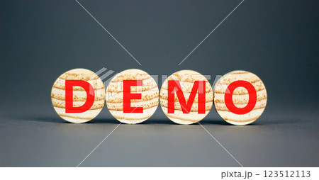 Demo symbol. Concept word Demo on beautiful wooden circles. Beautiful grey table grey background. Business and demo concept. Copy space. 123512113