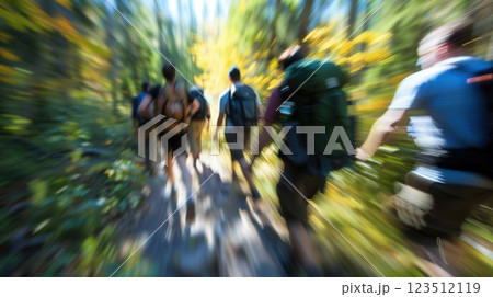 Fuzzy image of coworkers hiking together in the wilderness during the retreat Fuzzy image of coworkers hiking together in the wilderness during the retreat 123512119